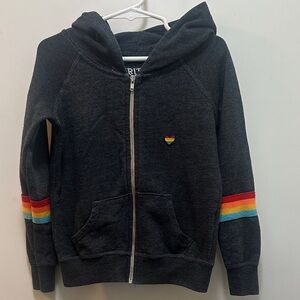 Spiritual Gangster Charcoal Zip Up Hoodie w/ Rainbow Accents Says, “Good Vibes”
